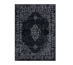 A contemporary take on a classic carpet with a thick wool pile in black and a faded design.